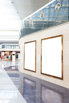 blank poster board wall in modern shopping mall