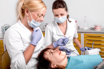 Fototapeta premium Senior woman on the dental operation.