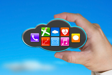 hand holding colorful app icons on black cloud with sky