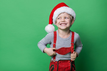 Beautiful little boy dressed like Christmas elf with big smile