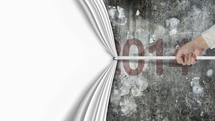 hand pulling blank white curtain covered dark red 2014 wall