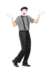 Mime artist gesturing joy with his hands
