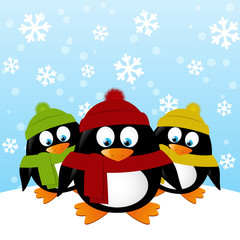 Cute cartoon penguins on winter background