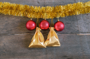 Gifts,  ball, tinsel on the wooden background