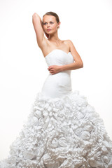 Fototapeta na wymiar Gorgeous bride in her wedding dress on white background
