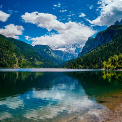 Fototapeta na wymiar Mountain lake between by mountains