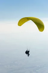 Gordijnen Paragliding high in the clouds  © zefart