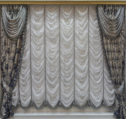 Curtains with lambrequins and white curtains with assemblies