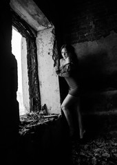 A girl freezes in solitude in the burned house