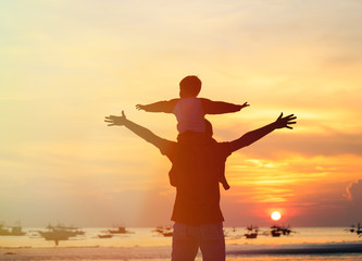Fototapeta premium father and son having fun on sunset