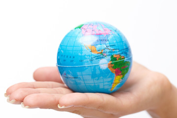 woman's hand with globe