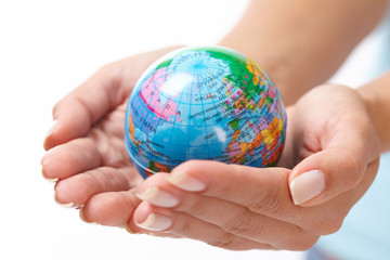 woman's hand with globe
