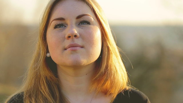 The red head teen girl at sunset time