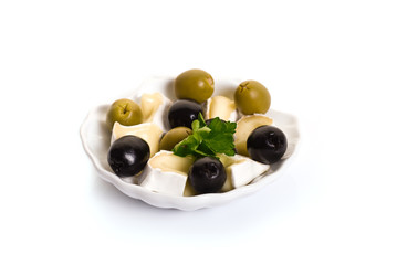 Olives and Brie Cheese on Shell-shaped Dish isolated on white