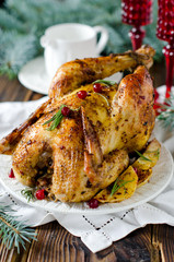 Christmas chicken baked with potatoes and cranberries