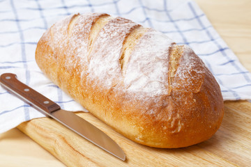 White bread loaf on wooden table