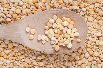 buckwheat isolated with a wooden spoon on white background