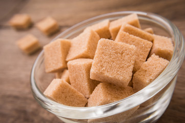 Brown sugar cubes in glass bowl