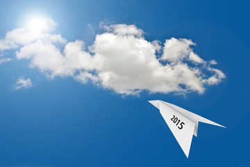 Naklejka na ściany i meble Paper plane on blue sky background