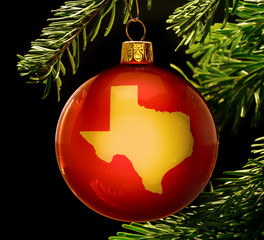 Red bauble with the golden shape of Texas