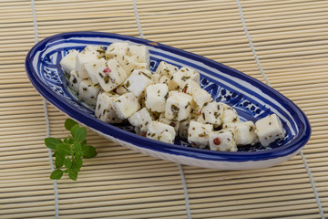 Cheese with spices and oil