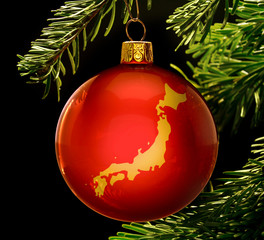 Red bauble with the golden shape of Japan