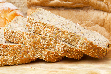Rye bread slices on wooden table