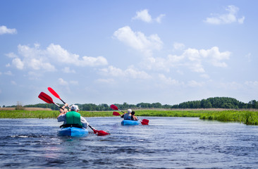 Elderly couples kayaking on Biebrza river