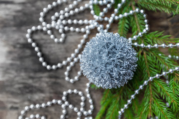 Silver Christmas ball on wooden background