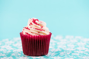 red cup cake on blue background