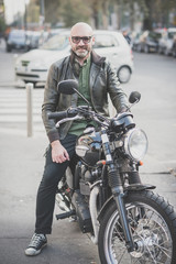 Fototapeta na wymiar handsome middle aged man motorcyclist