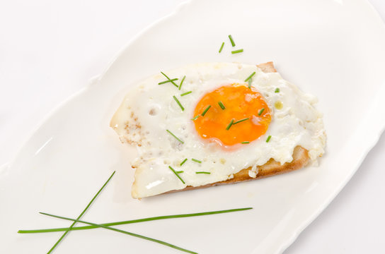 fried eggs with salt and chives