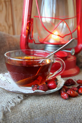 Cup of tea from the hips, dry rosehips and lantern.