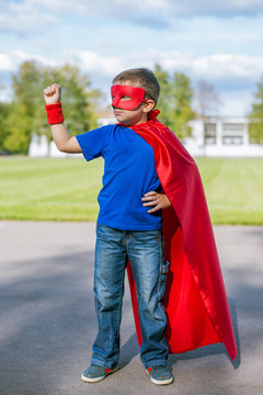 Superhero standing with arm raised