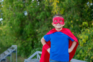 Superhero standing with hands on hips and smiling