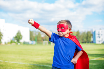 Superhero standing with raised arm and calling up
