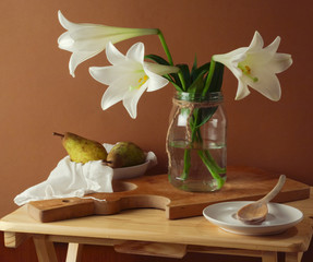 Still life with lily flower bouquet and pears