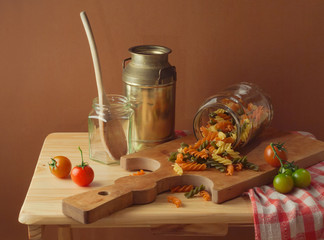Still life with fusilli pasta and tomatoes