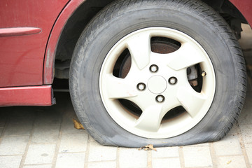 flat tyre on car wheel 