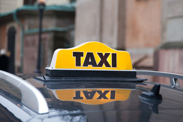 taxi cap on a car roof