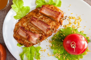 veal meat with bacon