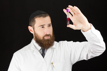 Jewish bearded doctor holding test tube.