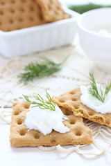 Snack crackers with cream cheese and dill