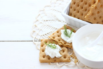 Flat gluten free bread with cream cheese and dill topping