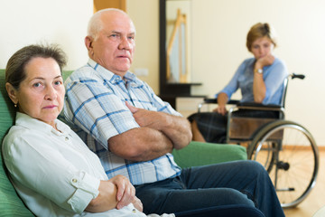 Obraz premium Mature couple and disabled woman indoor