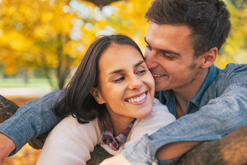 Portrait of romantic young couple outdoors in autumn