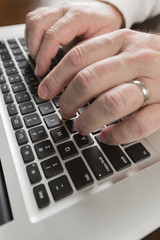 Male Hands Typing on Laptop Computer