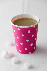 Coffee in a pink paper cup