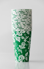 Green paper cup with flowers pattern