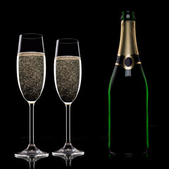 Champagne flutes on black background